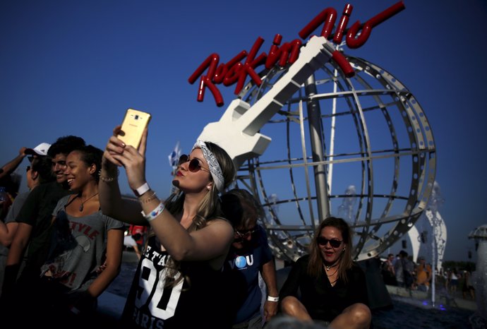 A rock fan takes a selfie as she arrives at the Rock in Rio Music Festival in Ri