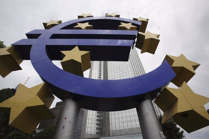 The Euro sign sculpture stands in front of the headquarters 