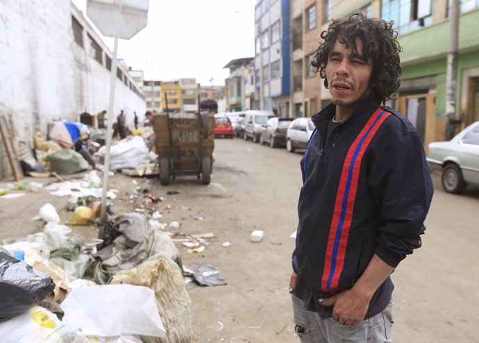 Fidel Bonilla, a homeless man who lives on the street, poses before a Reuters in
