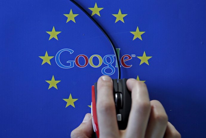 A woman hovers a mouse over the Google and European Union logos in Sarajevo, in 