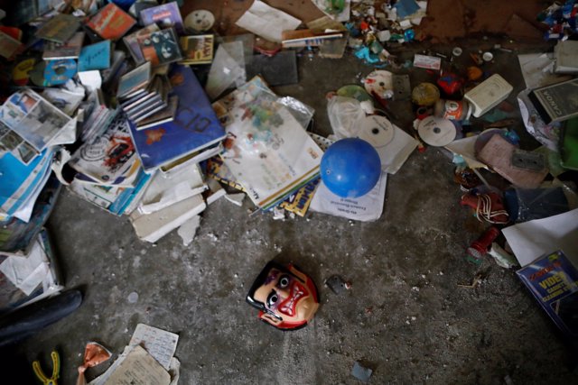 Debris is pictured on the floor of a house after an earthquake in San Juan Pilca