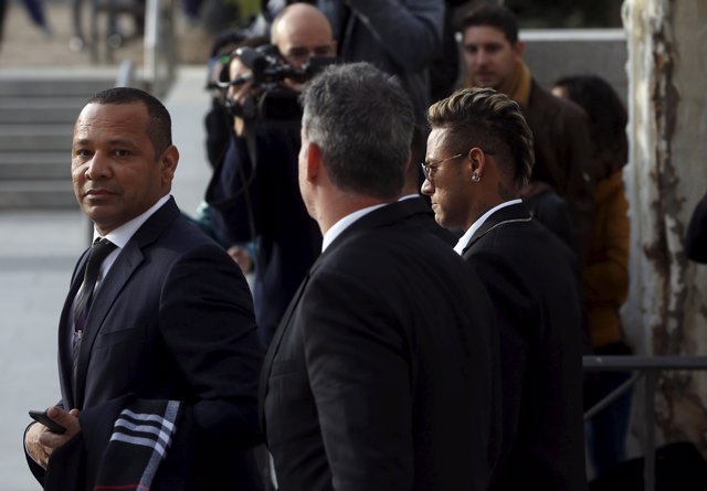 Barcelona's Neymar (R) arrives to testify at Spain's High Court in Madrid, Spain
