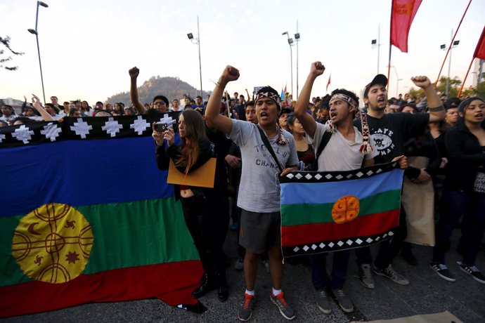 Mapuche Indian people shout slogans during a rally in Santiago, Chile, April 6, 