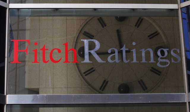 A clock is seen inside the lobby of the headquarters of Fitch Ratings. 