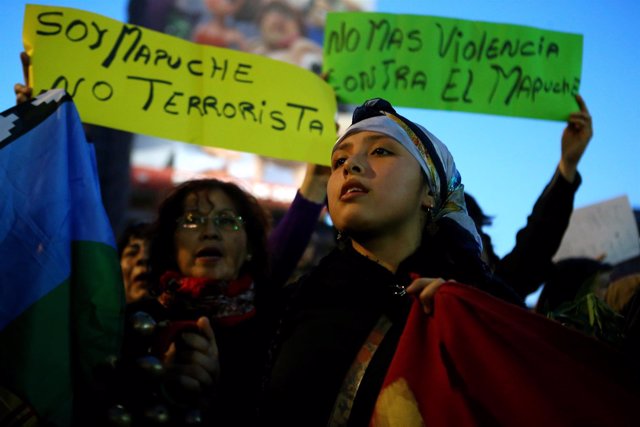 A Mapuche Indian activist attends a protest to demand justice for indigenous Map