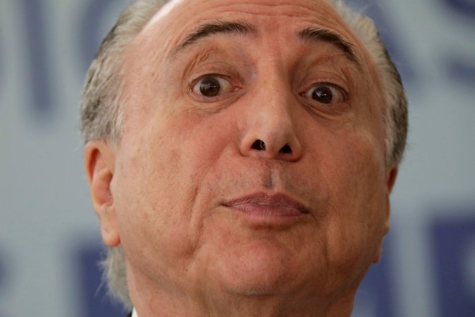 Brazil's President Michel Temer reacts during a ceremony in commemoration of the