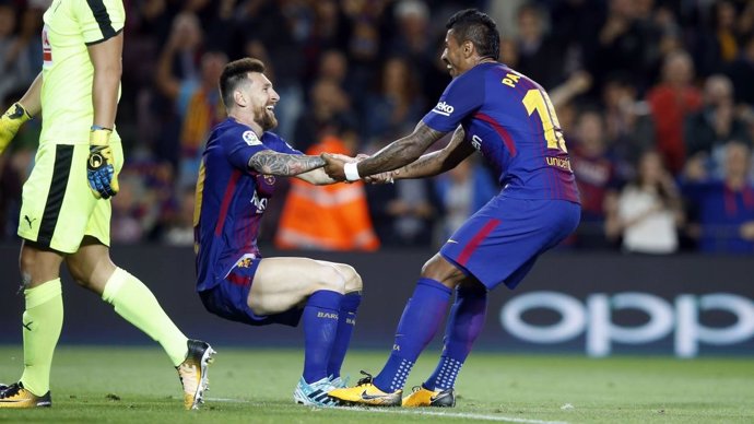 Paulinho y Messi con el Barcelona