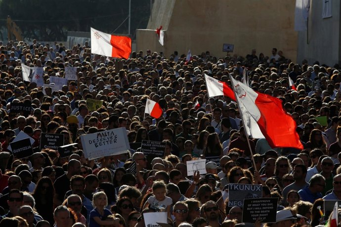 People protest against the assassination of investigative journalist Daphne Caru