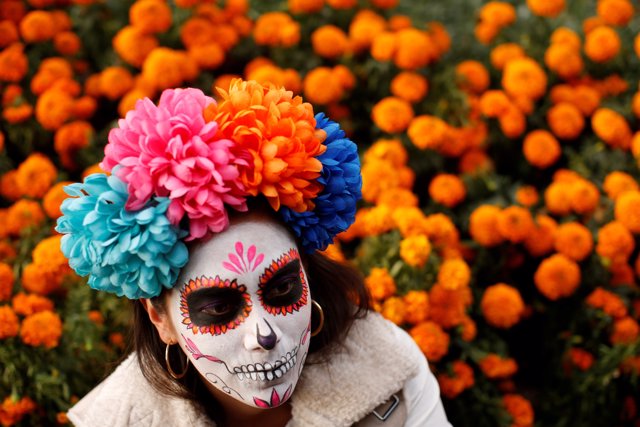A woman dressed up as "Catrina", a Mexican character also known as "The Elegant 