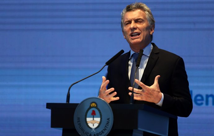 Argentina's President Mauricio Macri gestures as he speaks during a ceremony to 