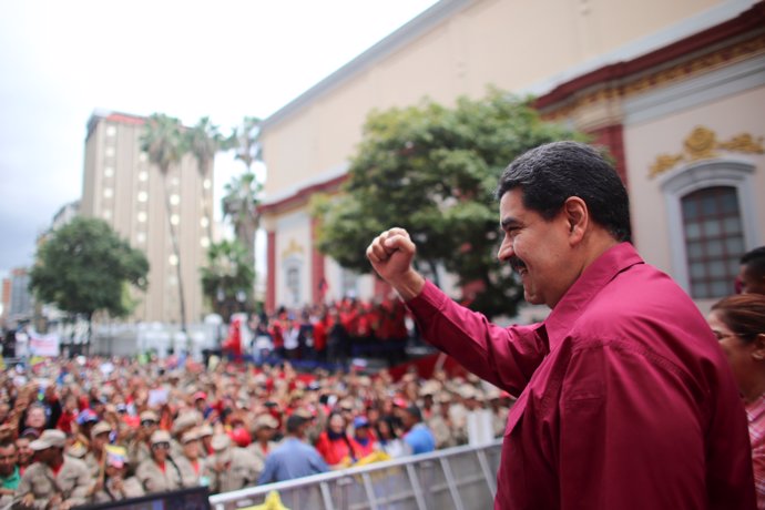 Venezuela's President Nicolas Maduro gestures as he arrives for a rally with sup