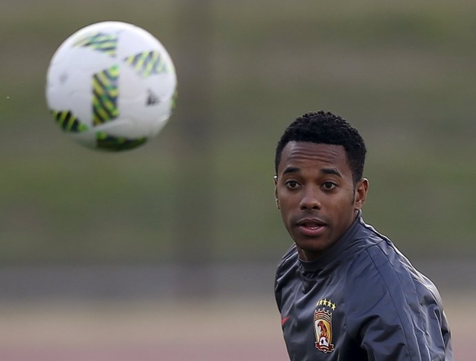 Guangzhou Evergrande's Robinho eyes the ball during a training session ahead of 