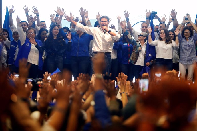 Honduras President and National Party candidate Juan Orlando Hernandez celebrate