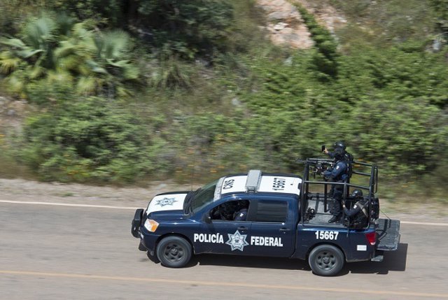 Mexican federal police officers take part in a security operation in Ejido de Ca