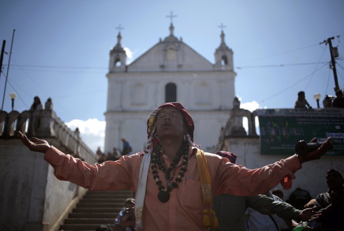 Carlos Tun, a Mayan priest, prays and participates in the pre-Hispanic mass of "