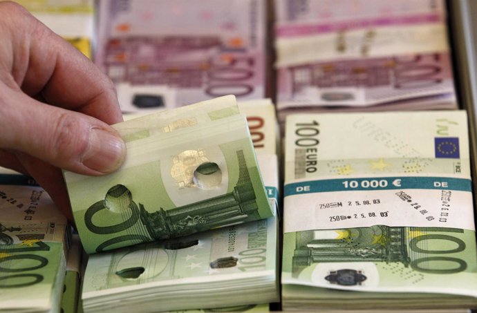 Punctured euro banknotes which are used to train sniffer dogs, are presented to 