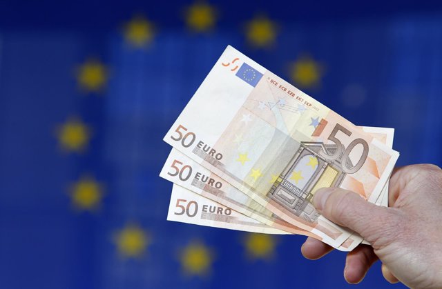 A picture illustration shows euro banknotes outside the European Commission head