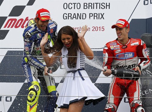 Winning Yamaha MotoGP rider Valentino Rossi of Italy (L) and third placed Ducati