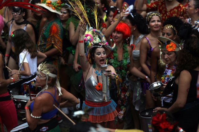 Revellers take part in an annual block party known as "Ceu na Terra" (Heaven on 
