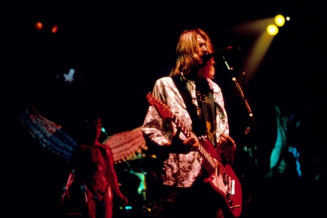 Nirvana frontman Kurt Cobain performing on stage at the MTV Live and Loud concer