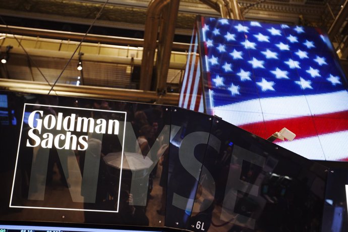 The Goldman Sachs logo is displayed on a post above the floor of the New York St