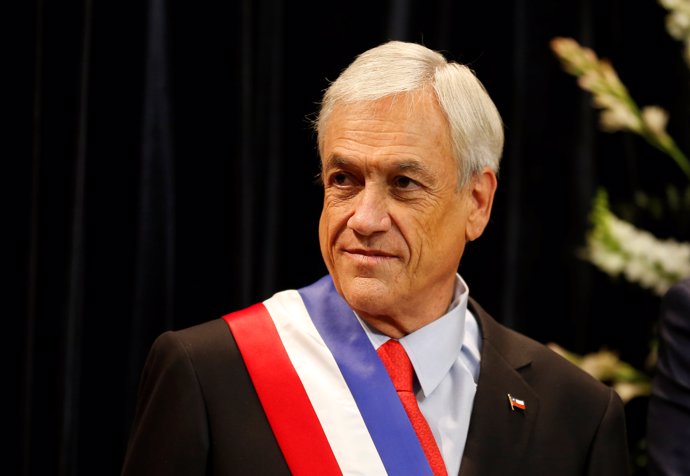 Chile's President Sebastian Pinera waits to receive protocol greetings at La Mon