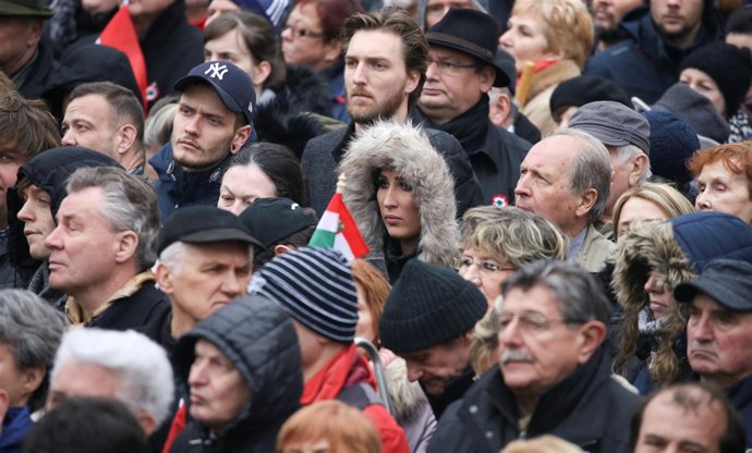 People listen as Hungary's Prime Minister Viktor Orban speaks during Hungary's N