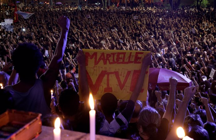 Demonstrators rally the against the death of Rio de Janeiro city councilor Marie