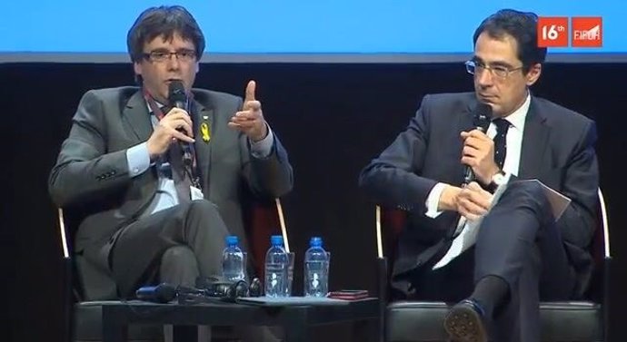 El expresidente de la Generalitat Carles Puigdemont en un debate en Ginebra