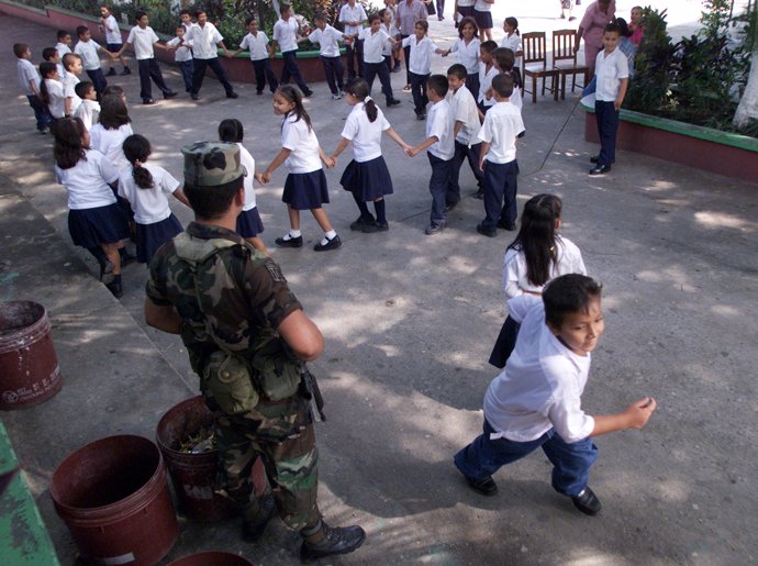 A Honduran soldier stands guard in the Lila Luz de Maradiaga elementary
School 