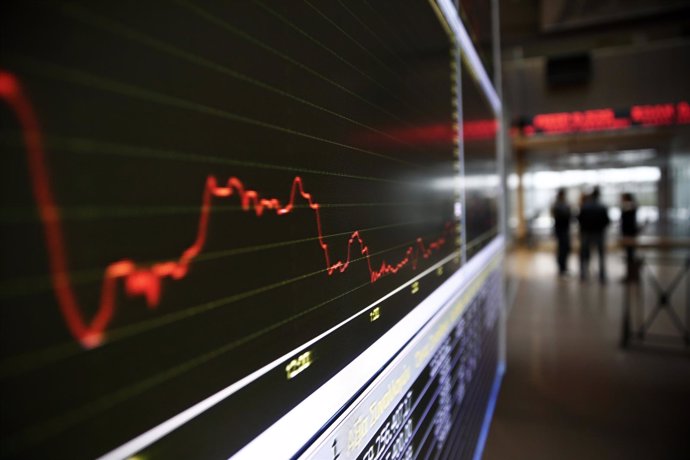 A monitor shows the general index inside the Athens Stock Exchange February 9, 2