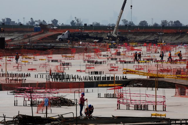 Employees work on the terminals foundations at the construction site of the new 