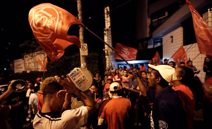 Supporters of former Brazil president Luiz Inacio Lula da Silva shout slogans in