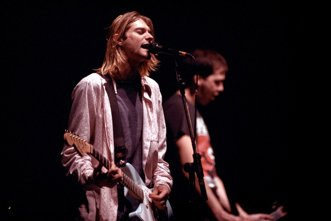 Nirvana frontman Kurt Cobain performing on stage at Le Zenith in Paris, France
