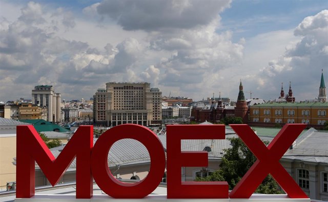 The letters MOEX are pictured at the Moscow Exchange, with the Kremlin and the F