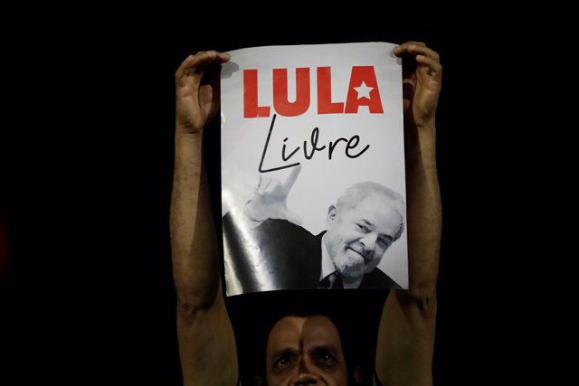Supporters of former Brazil president Luiz Inacio Lula da Silva react during jus