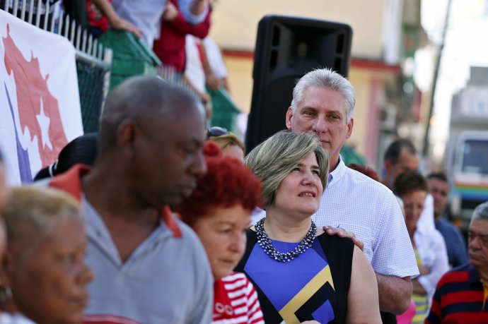Cuba's First Vice-President Miguel Diaz-Canel stands in line with his wife Lis C