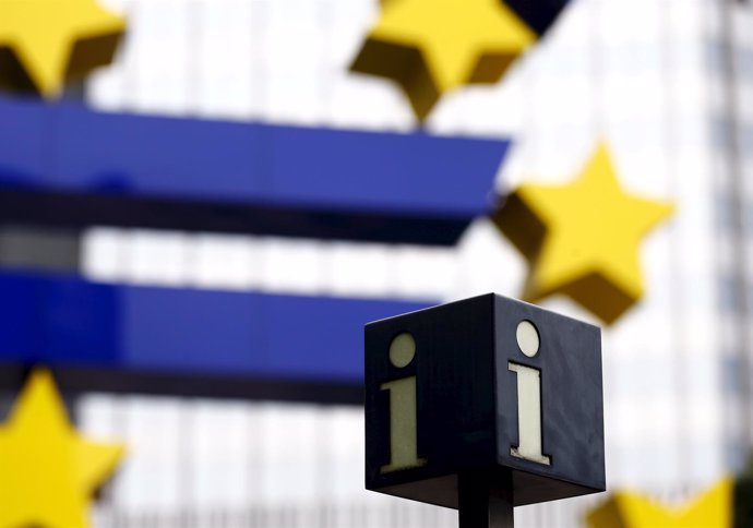 A tourist information sign is seen next to the euro sign landmark outside the fo