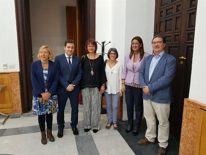 López (izda.), durante la celebración del acto