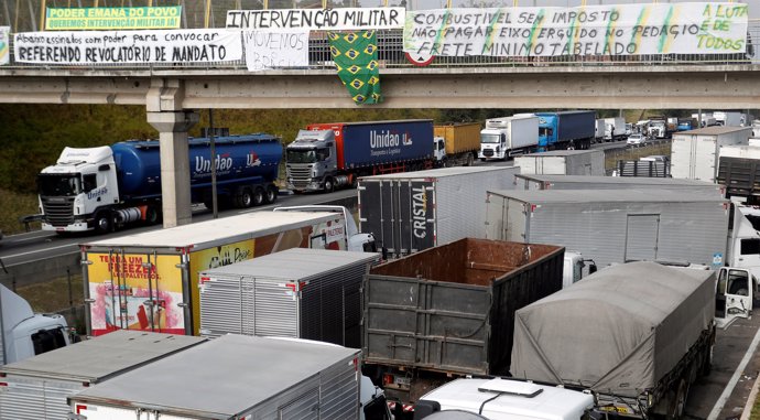 Truckers attend a protest against high diesel fuel prices at BR-116 Regis Bitten