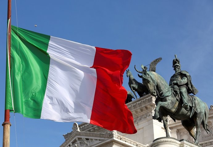 The Italian flag waves in front of The "Altare della Patria" also known as "Vitt