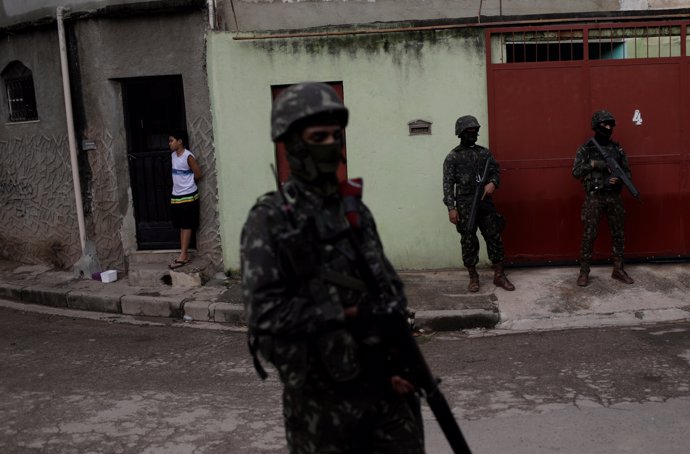 Brazilian Army soldiers patrol during an operation against drug dealers in the C
