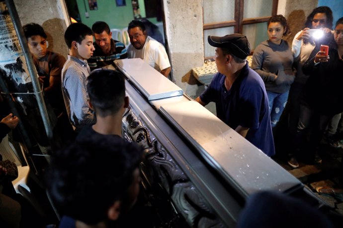 Relatives of Natividad Tuchan, who died during the eruption of the Fuego volcano