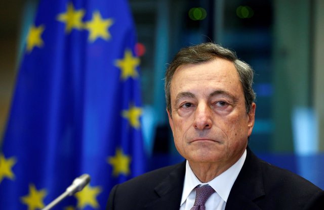 European Central Bank (ECB) President Mario Draghi waits to address the European