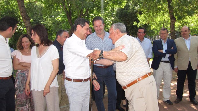 Juanma Moreno con Adolfo Molina