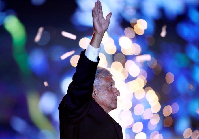 Mexican presidential candidate Andres Manuel Lopez Obrador waves to supporters d