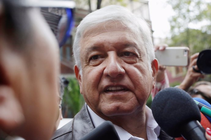 Mexican President-elected Andres Manuel Lopez Obrador talks to a journalist as h