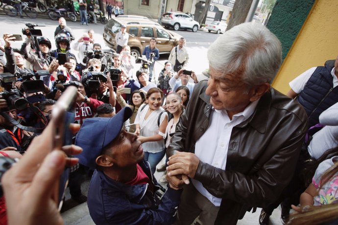 Mexican President-elected Andres Manuel Lopez Obrador greats to supporters as he