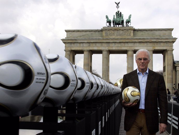 Franz Beckenbauer, President of Germany's World Cup organising committee, holds 