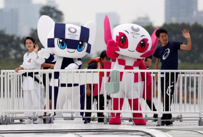 Tokyo 2020 Olympic Games mascot Miraitowa and Paralympic mascot Someity wave wit